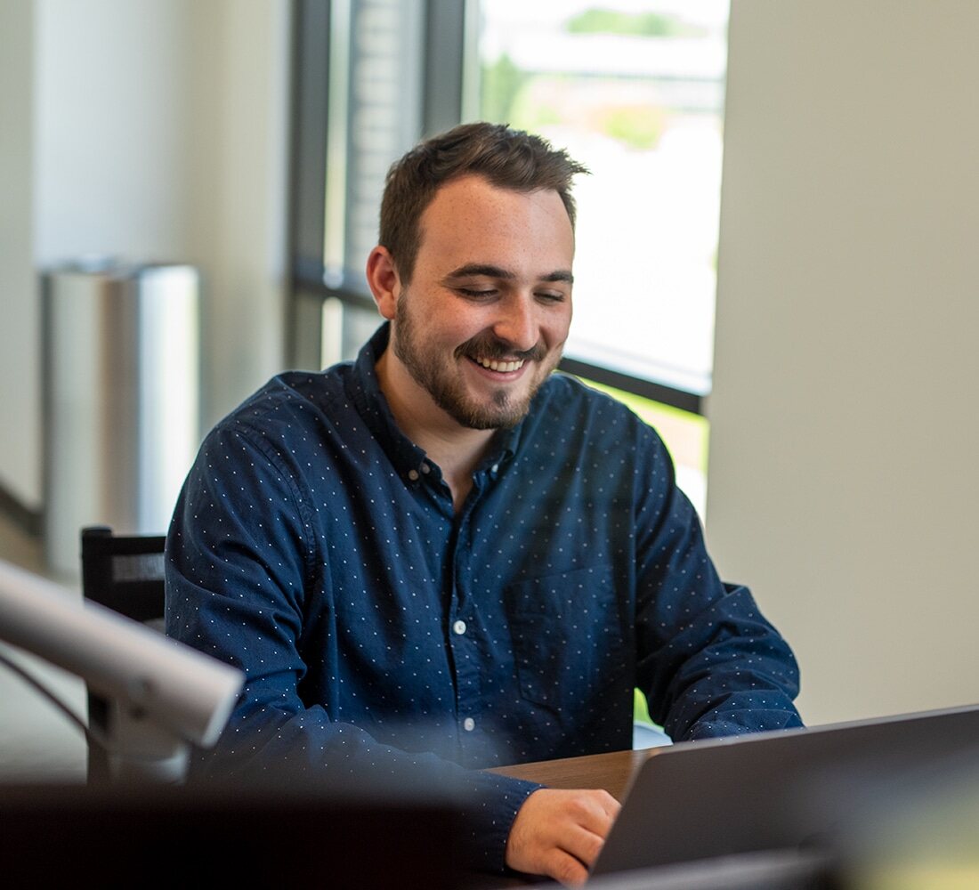 Matt Dragoo sitting at computer