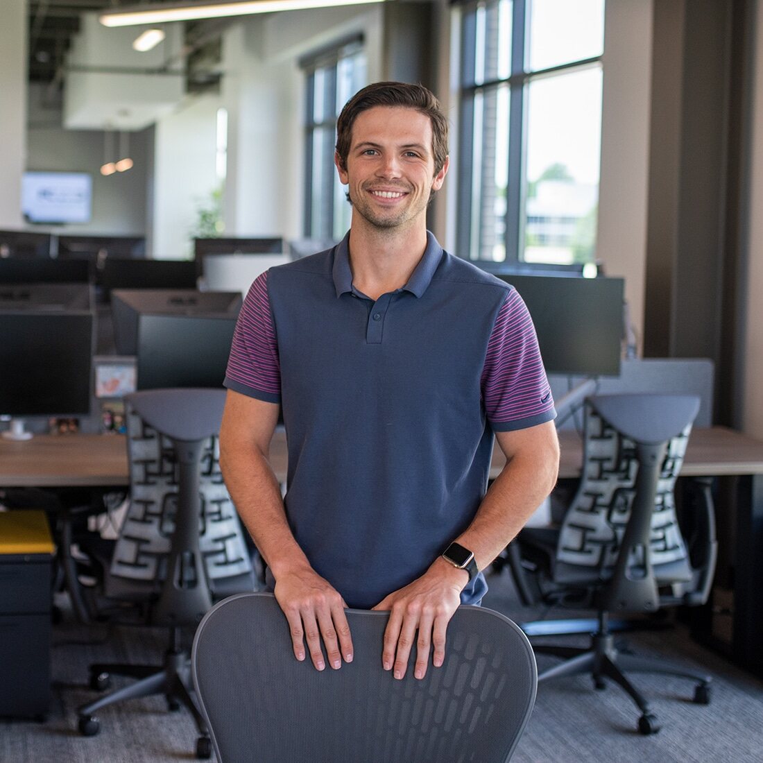 Austen standing in the office